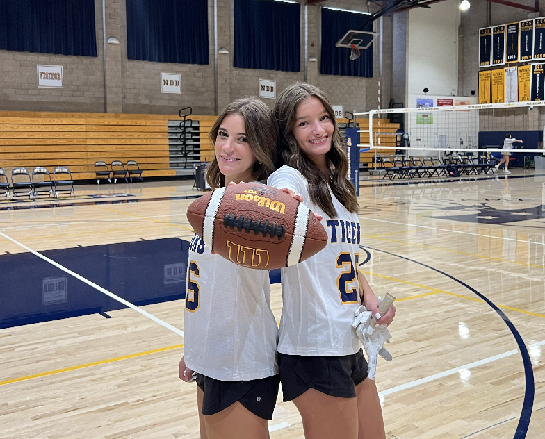 Flag football seniors Jane Hipps and Hailey Kockos pose during media day.